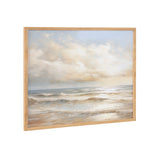 Framed wall art showing a beach waves sunset cloud landscape in soft tones