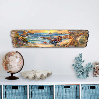 Retro car parked on beach at sunrise depicted on wooden wall art