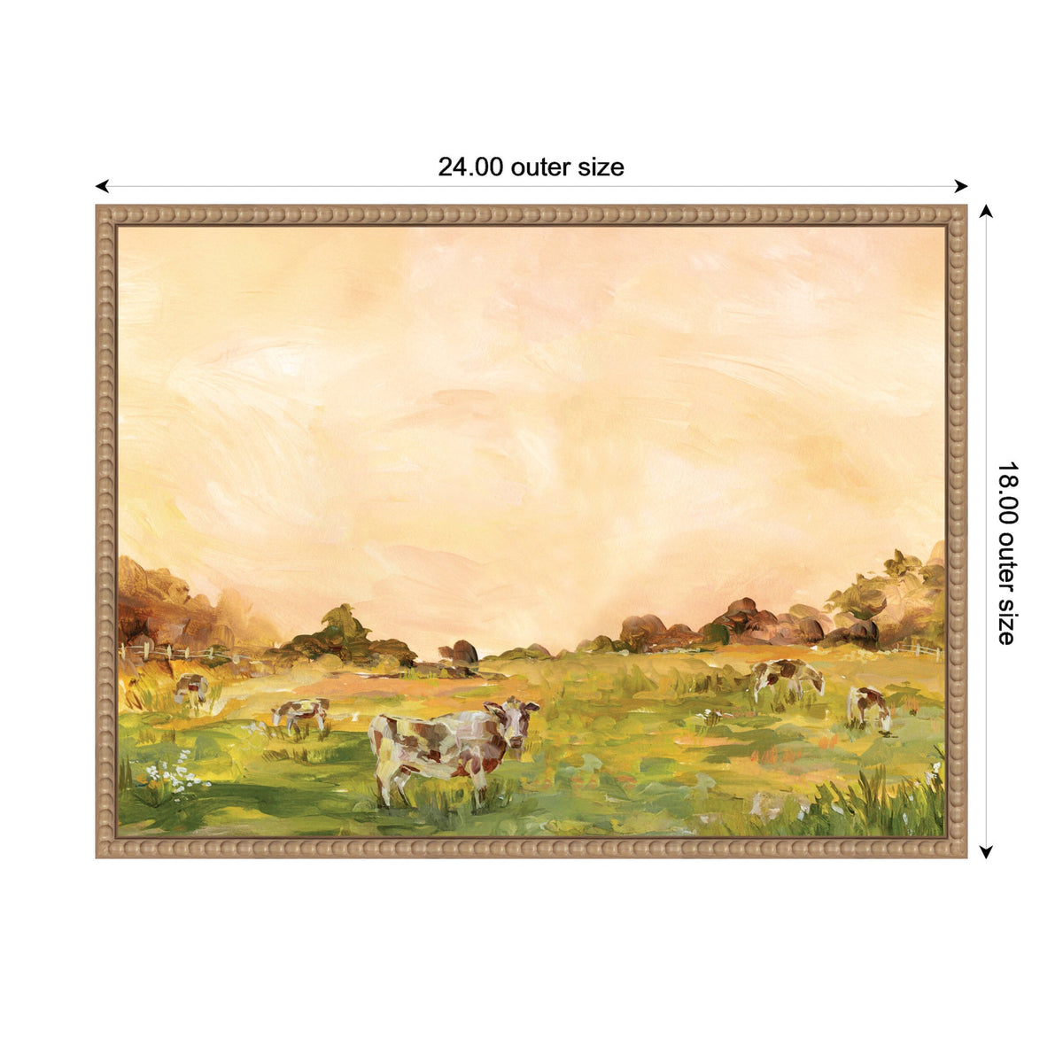 Framed canvas painting showing cows grazing in a green field under a soft orange sky, with trees in the background and flowers in the foreground.