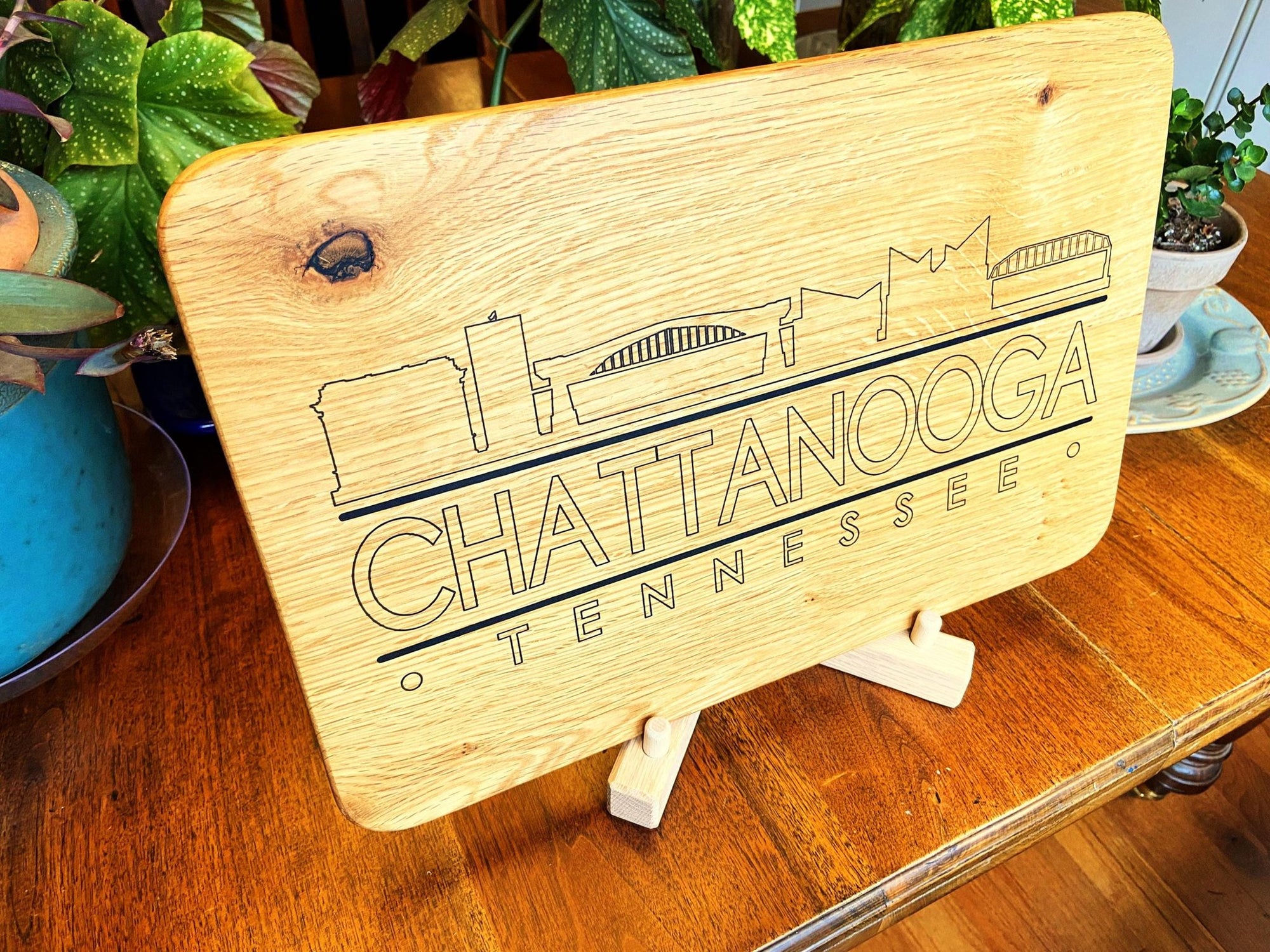 Handmade white oak charcuterie board with engraved Chattanooga skyline