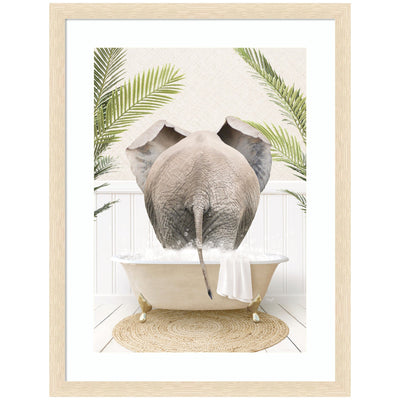 Framed wall art print showing an elephant back in a palm bathtub, designed by Amy Peterson