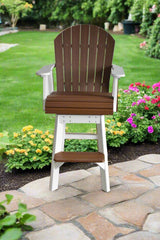 Swivel Adirondack chair with dark brown slatted back and seat, white frame and footrest, positioned on stone patio near vibrant garden flowers