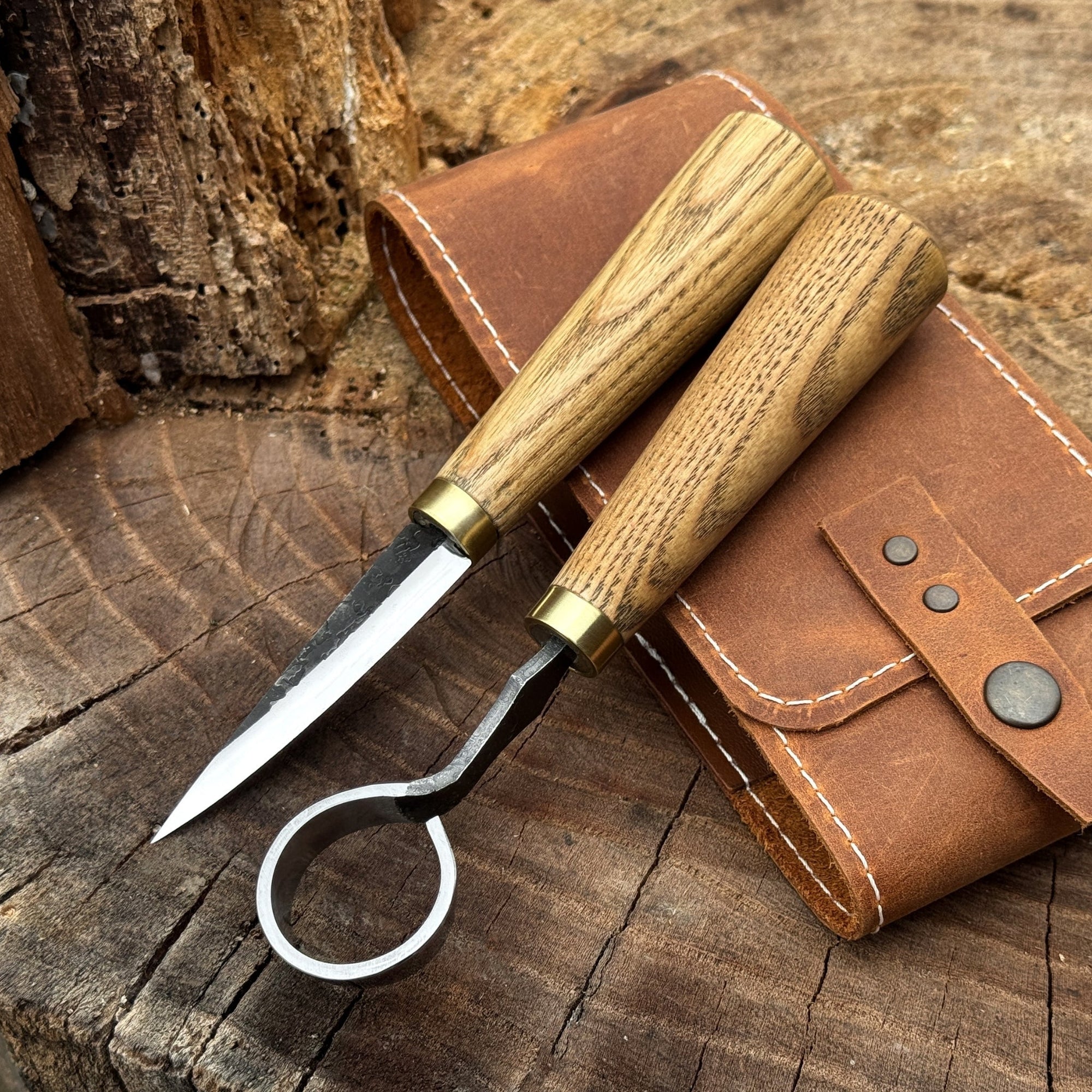 2-piece spoon carving tool set with leather case, featuring hand-forged carbon steel blades and ash wood handles