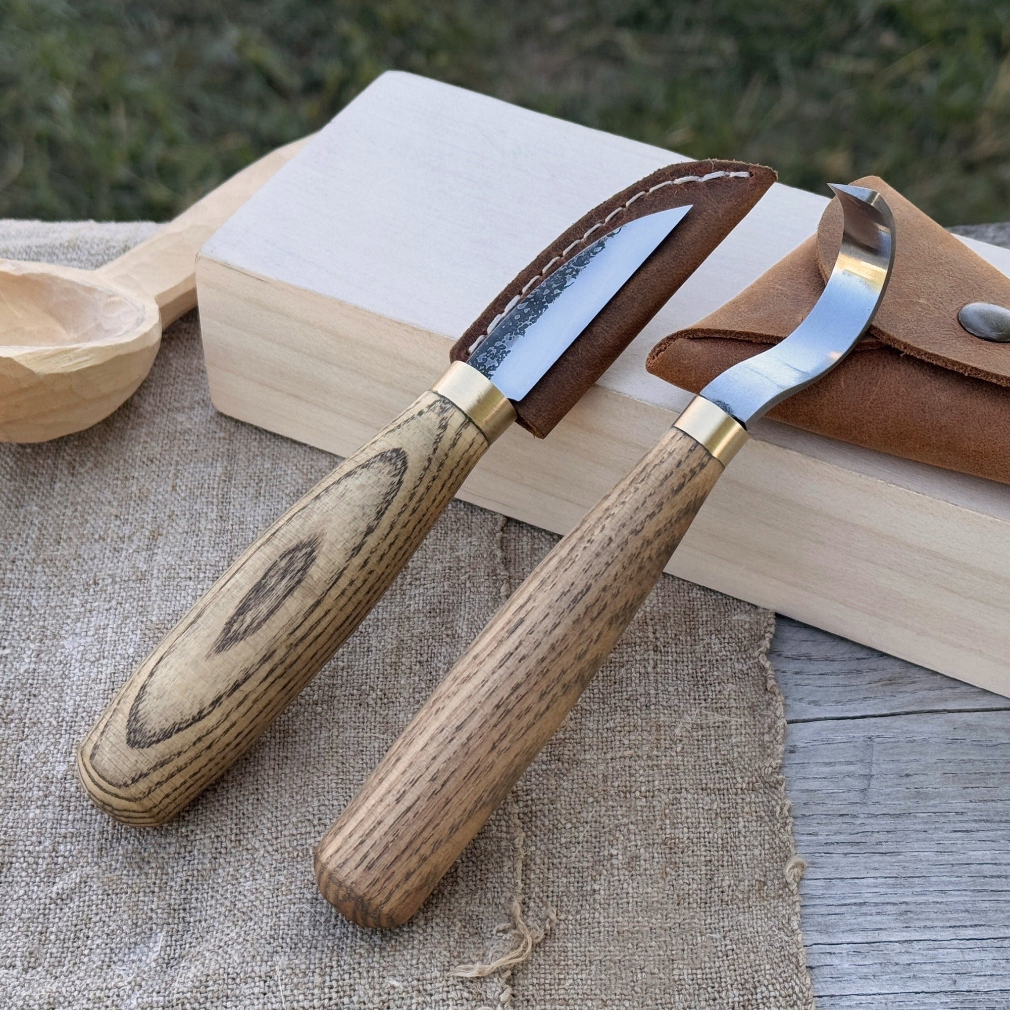 2-piece wood carving knife set with whittling and hook knives, ash wood handles, and leather sheath