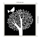 Black and white linocut canvas featuring a tree with rounded leaves and a stylized bird perched near its branches, framed with a beaded white border.