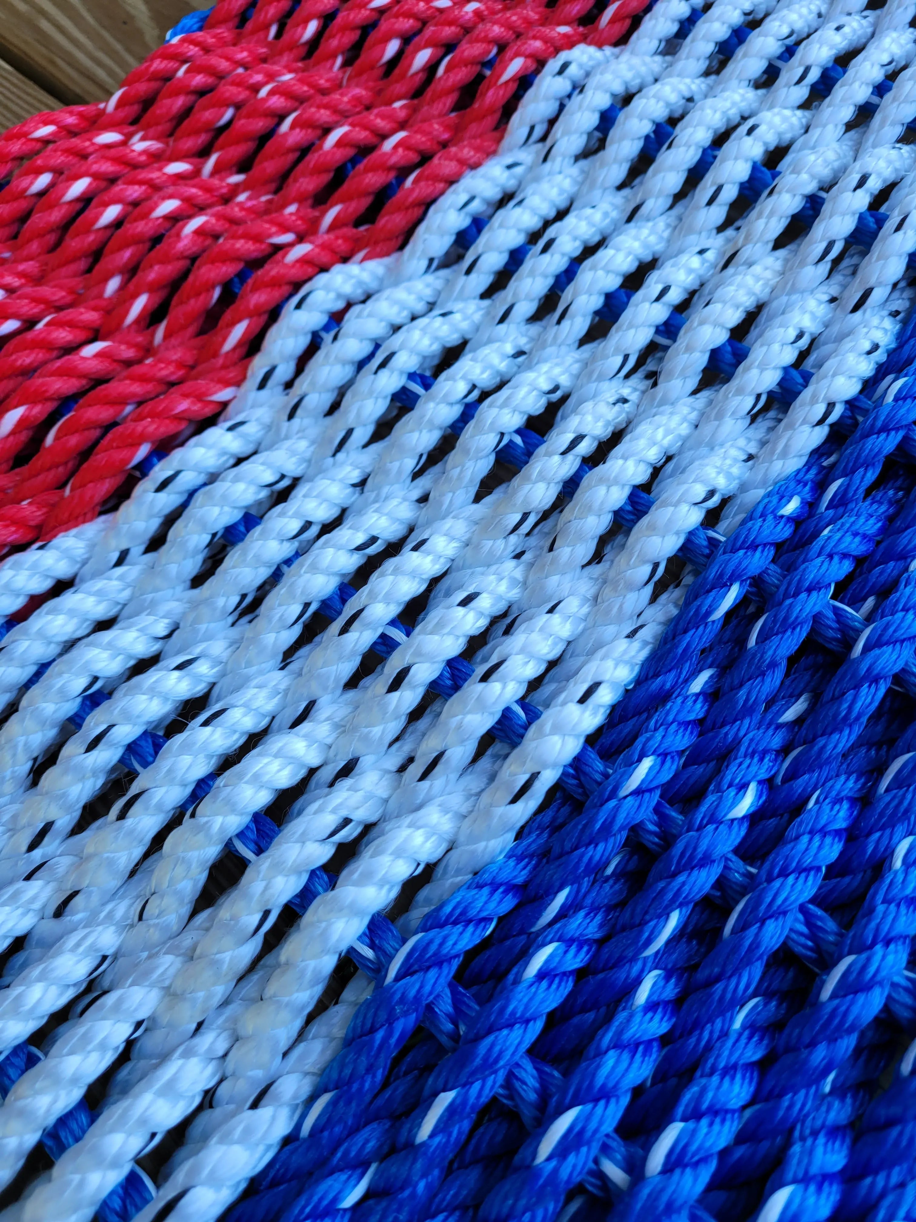 Red white and blue striped lobster rope mat handcrafted from authentic lobster rope
