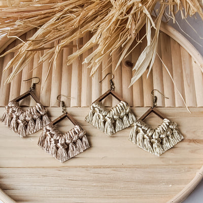 Macrame Fringe Earrings in metallic tones displayed on a wooden surface