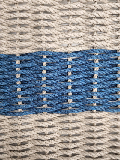 Handmade lobster rope mat in tan and navy blue colors