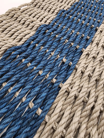 Handmade lobster rope mat in tan and navy blue colors