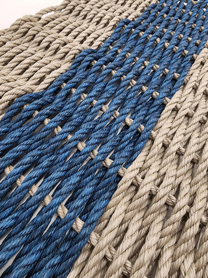 Handmade lobster rope mat in tan and navy blue colors