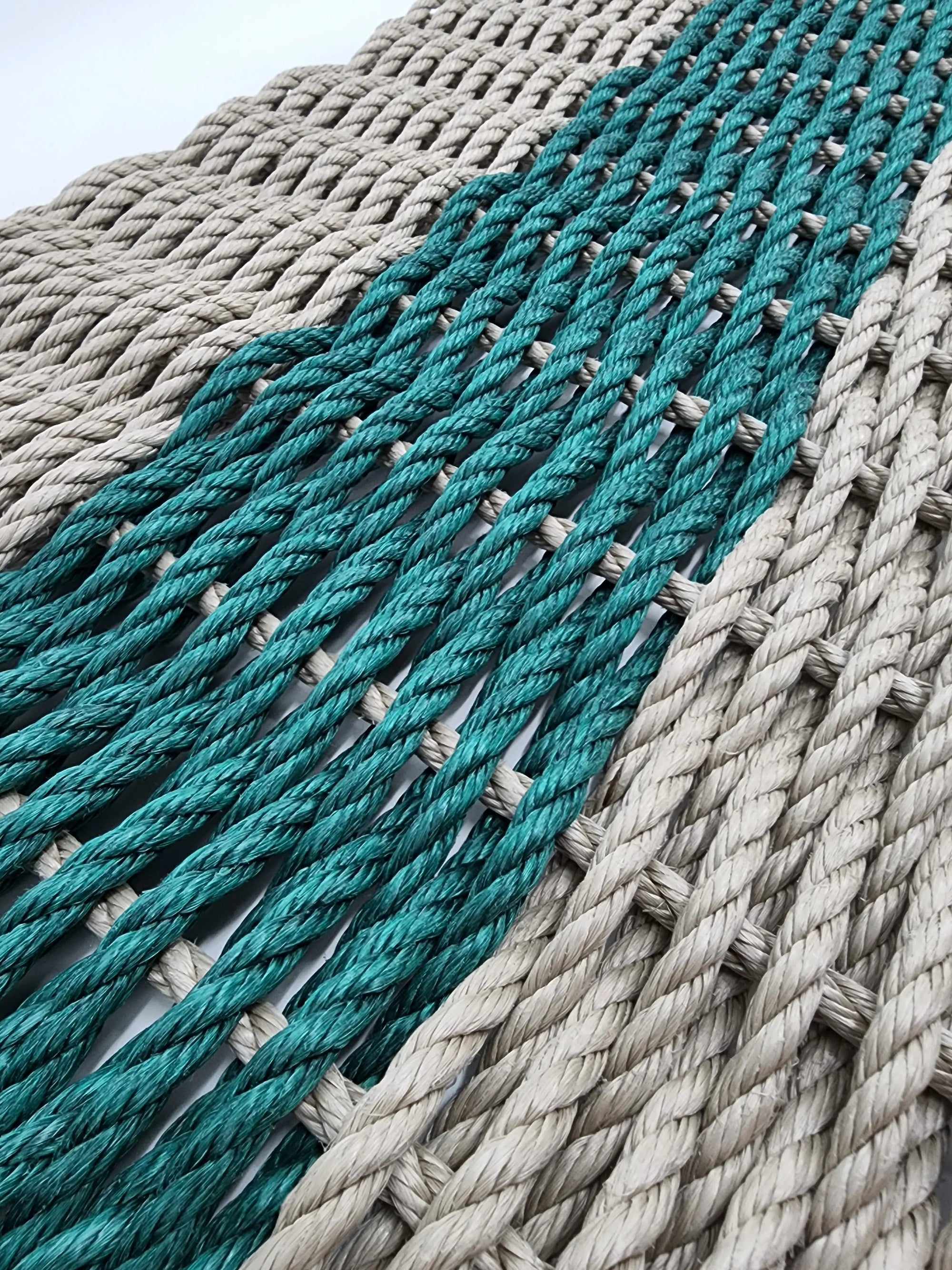 Tan and hunter green handmade lobster rope mat made from lobster trap rope