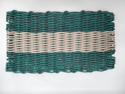 Hunter Green and Tan handmade lobster rope mat on wooden floor