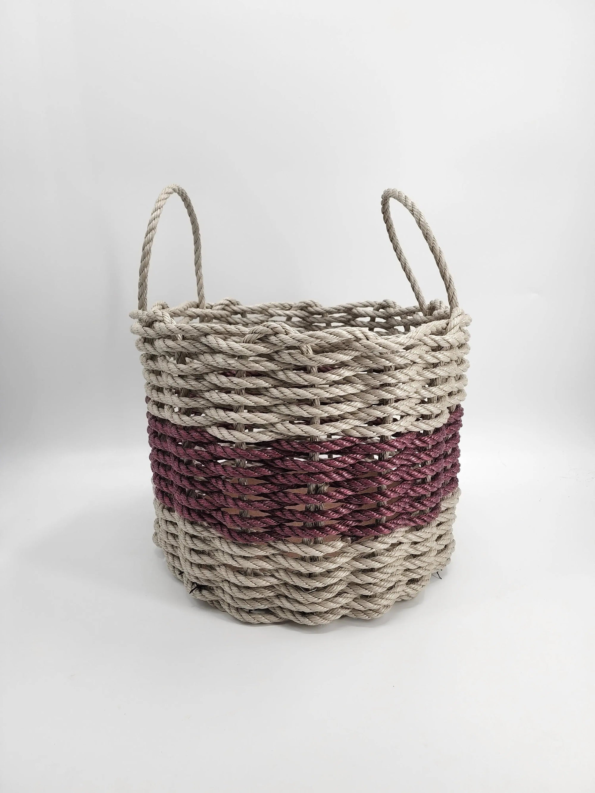Handmade storage basket woven from tan and burgundy Maine lobster rope with mesh bottom and removable platform