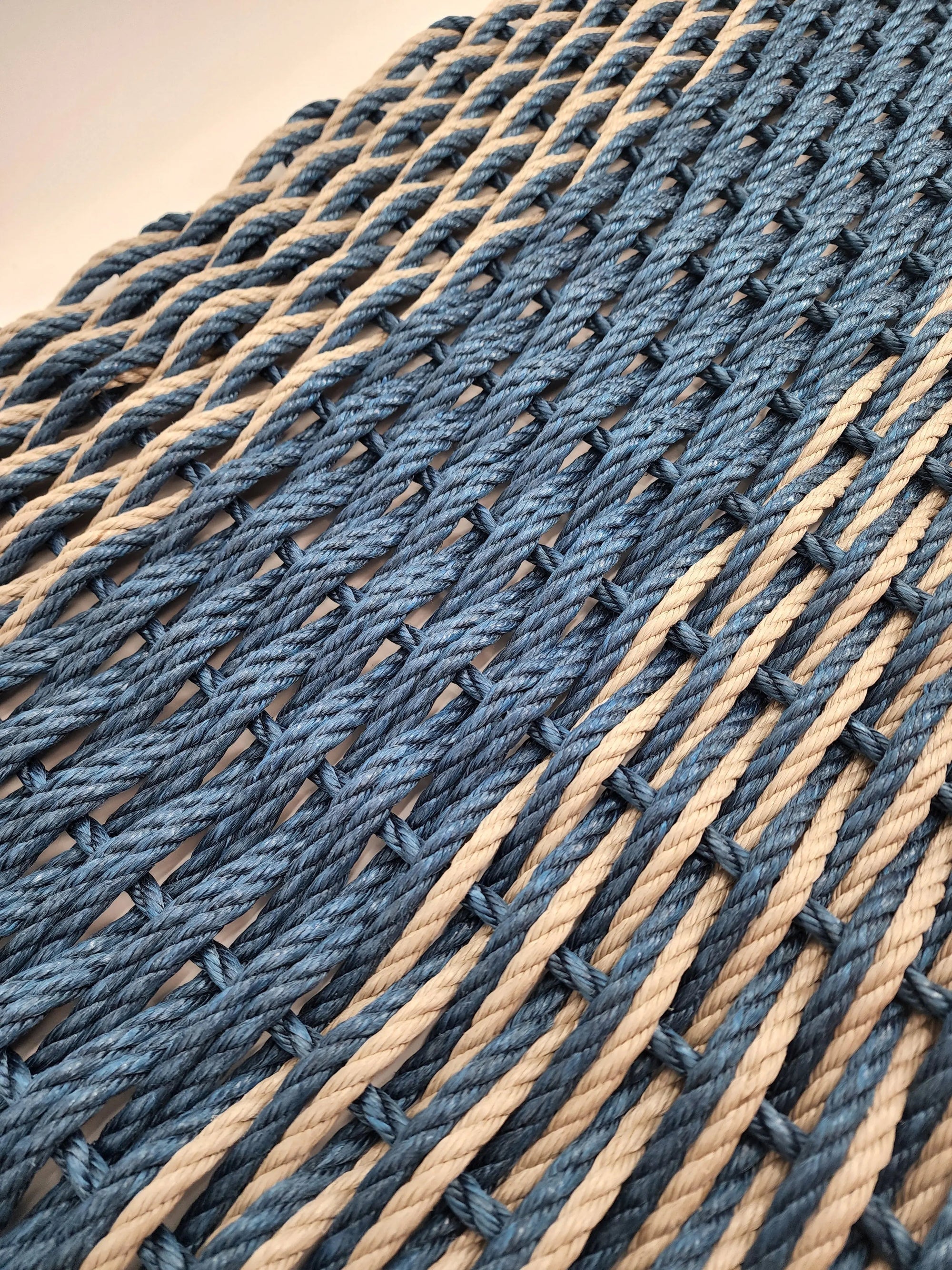 Large navy blue and tan lobster rope mat with double basket weave