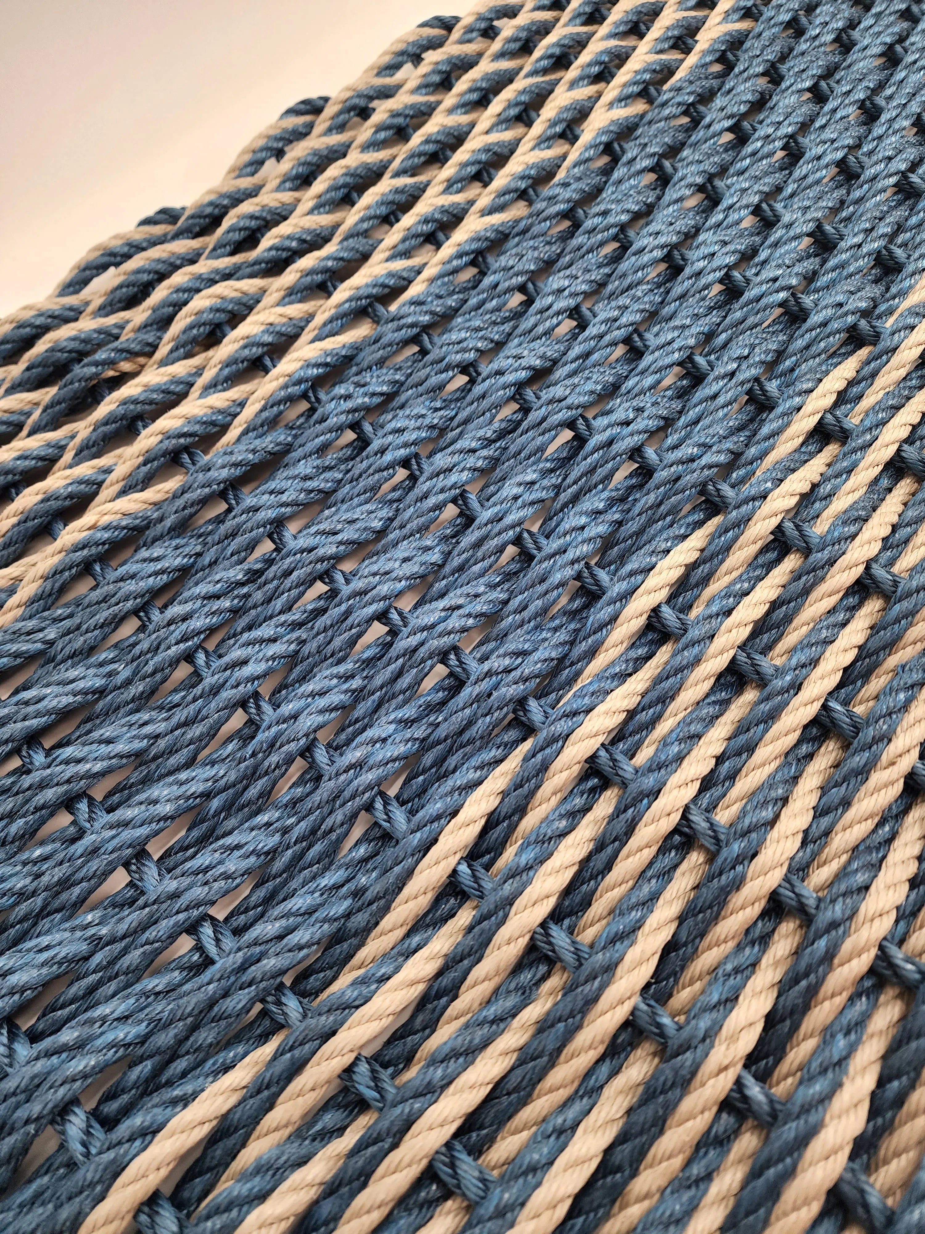 Large navy blue and tan lobster rope mat with double basket weave