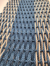 Large navy blue and tan lobster rope mat with double basket weave
