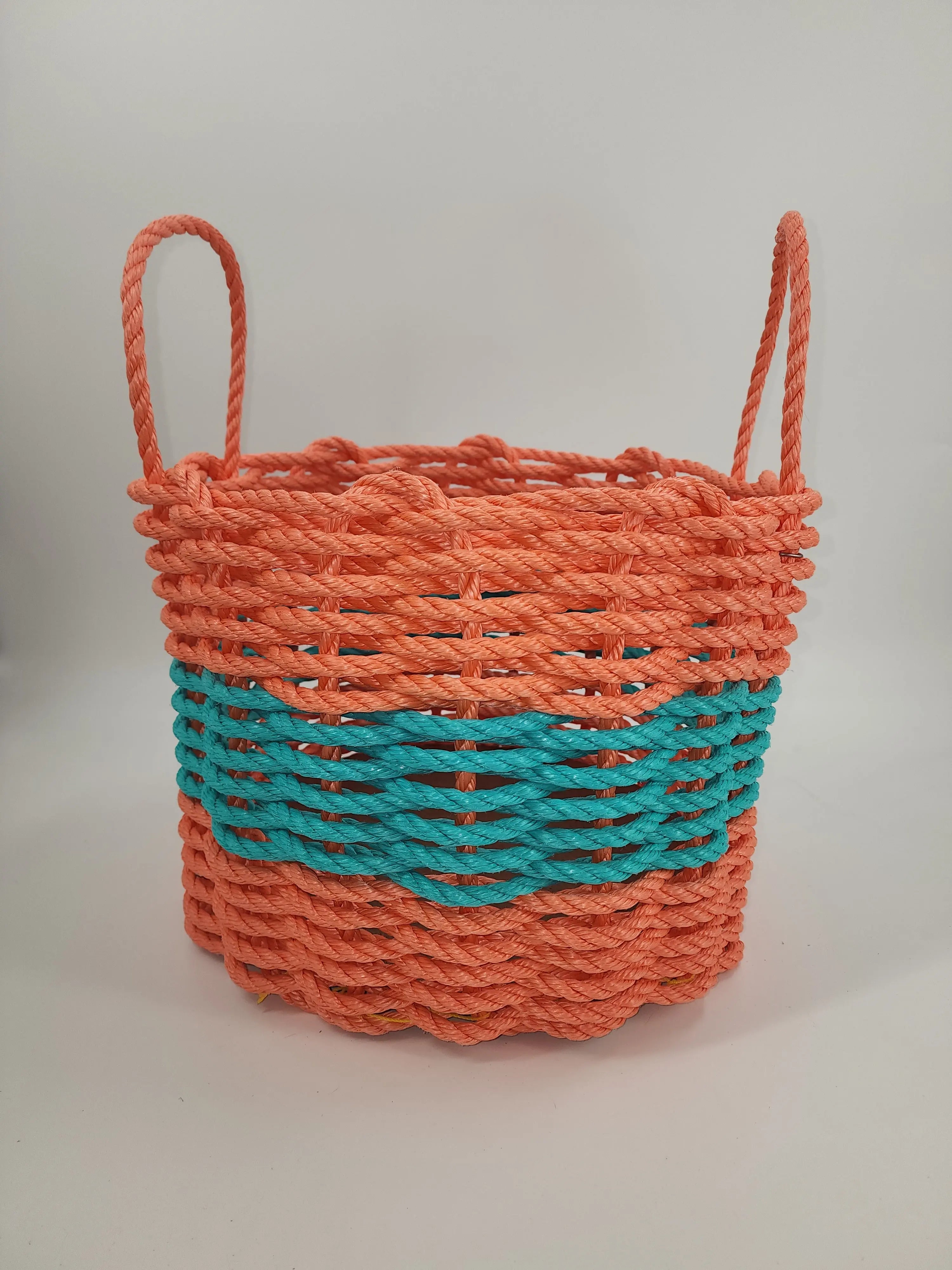 Handmade lobster rope storage basket in coral orange and teal colors
