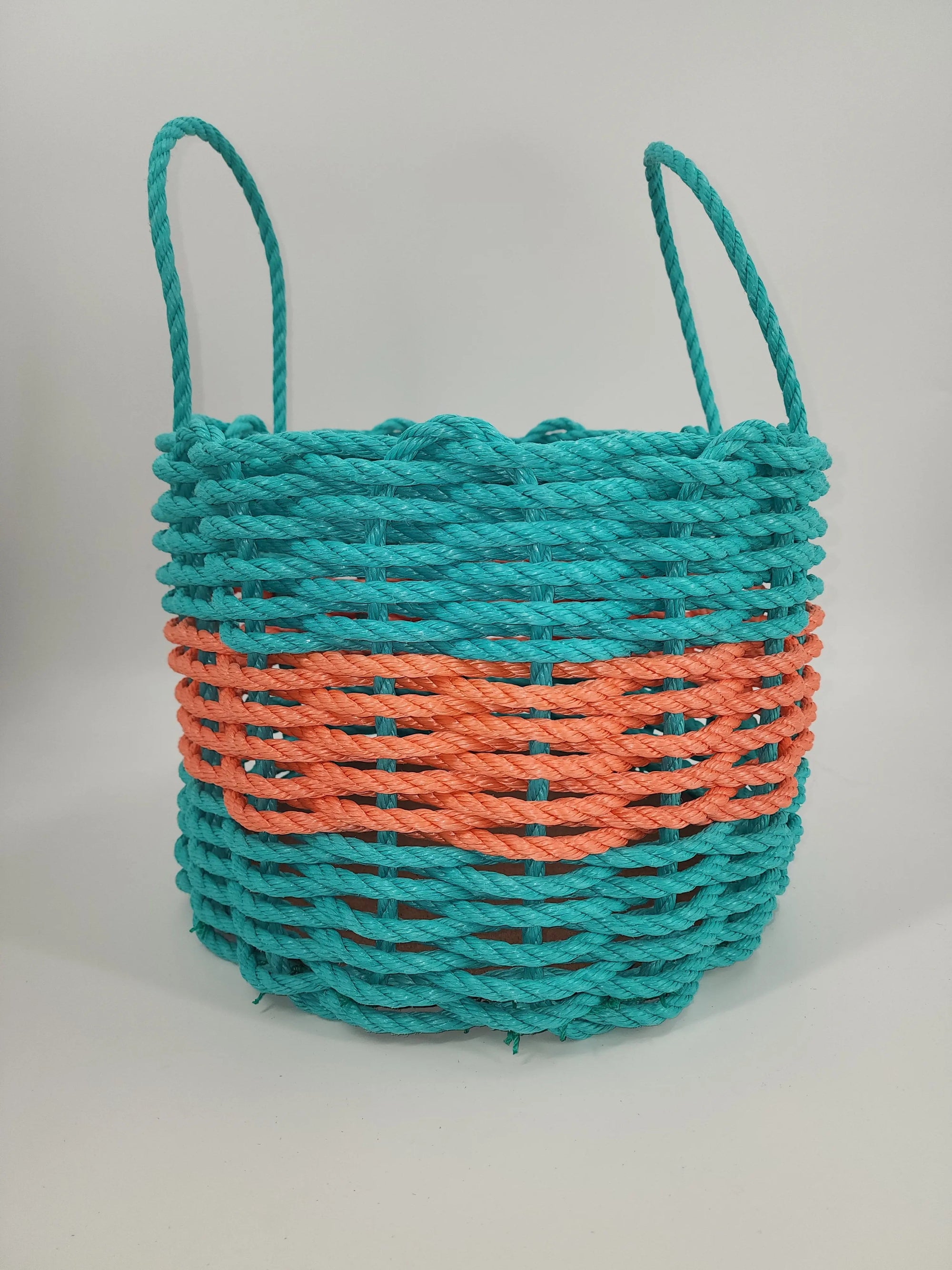 Handmade teal and coral orange lobster rope storage basket with mesh bottom and removable platform