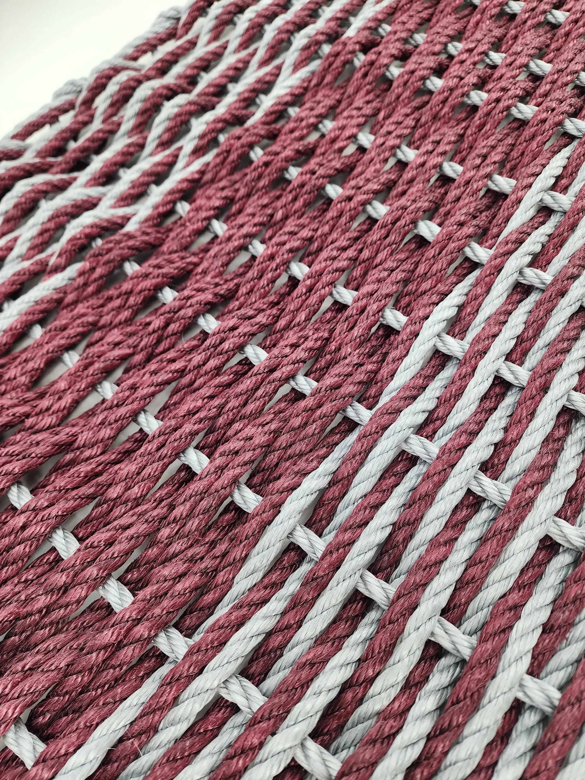 Large burgundy red and light gray lobster rope mat with double weave basket pattern