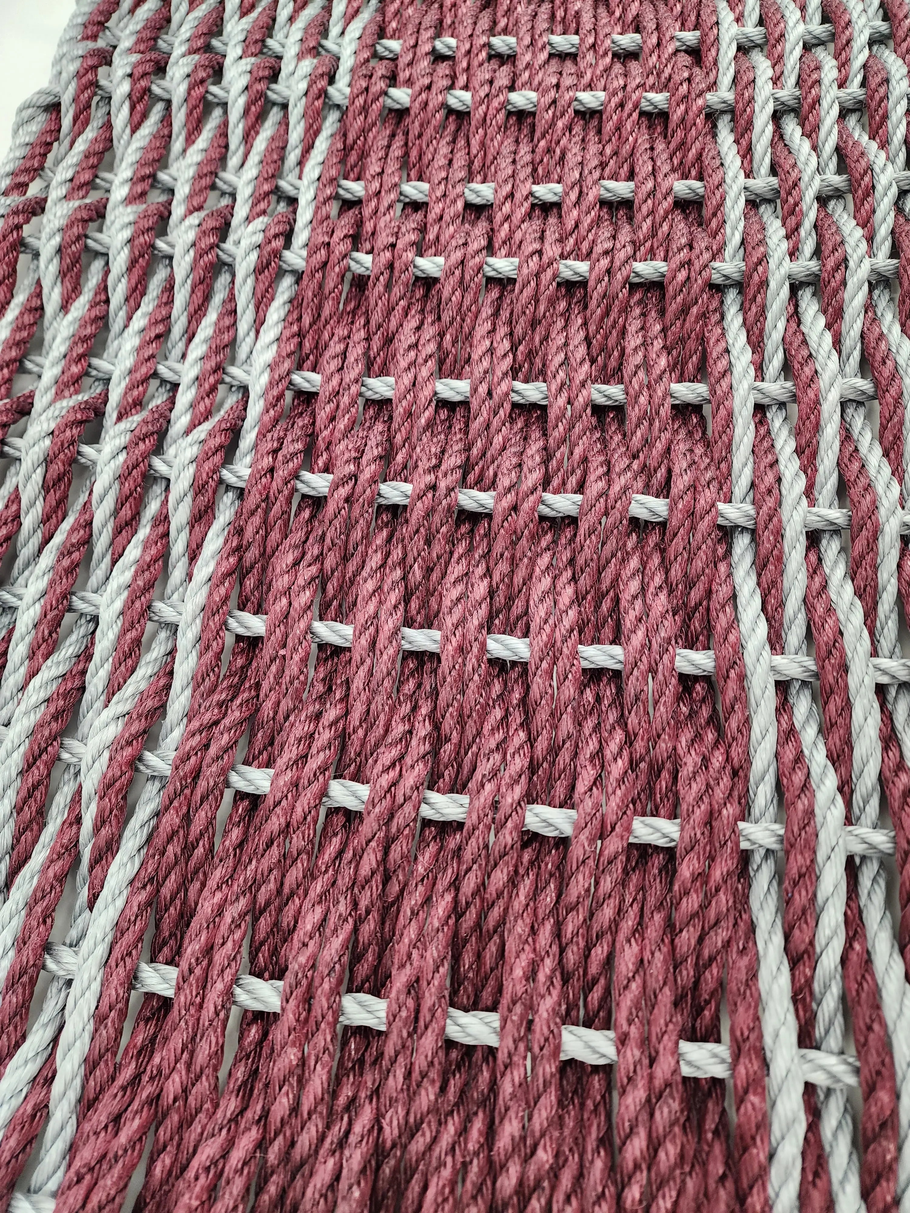 Large burgundy red and light gray lobster rope mat with double weave basket pattern