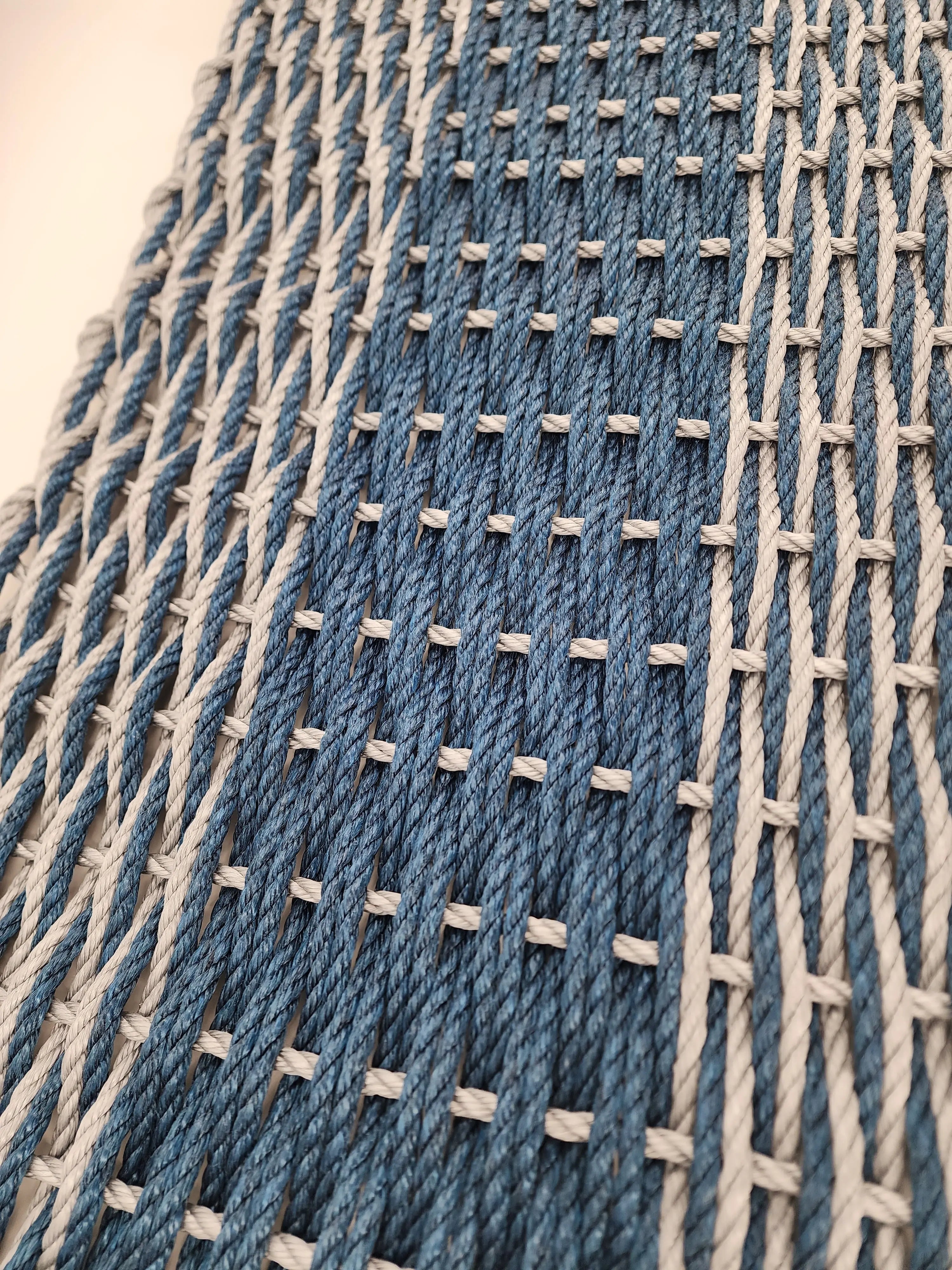Large navy blue and light gray lobster rope mat with double basket weave pattern