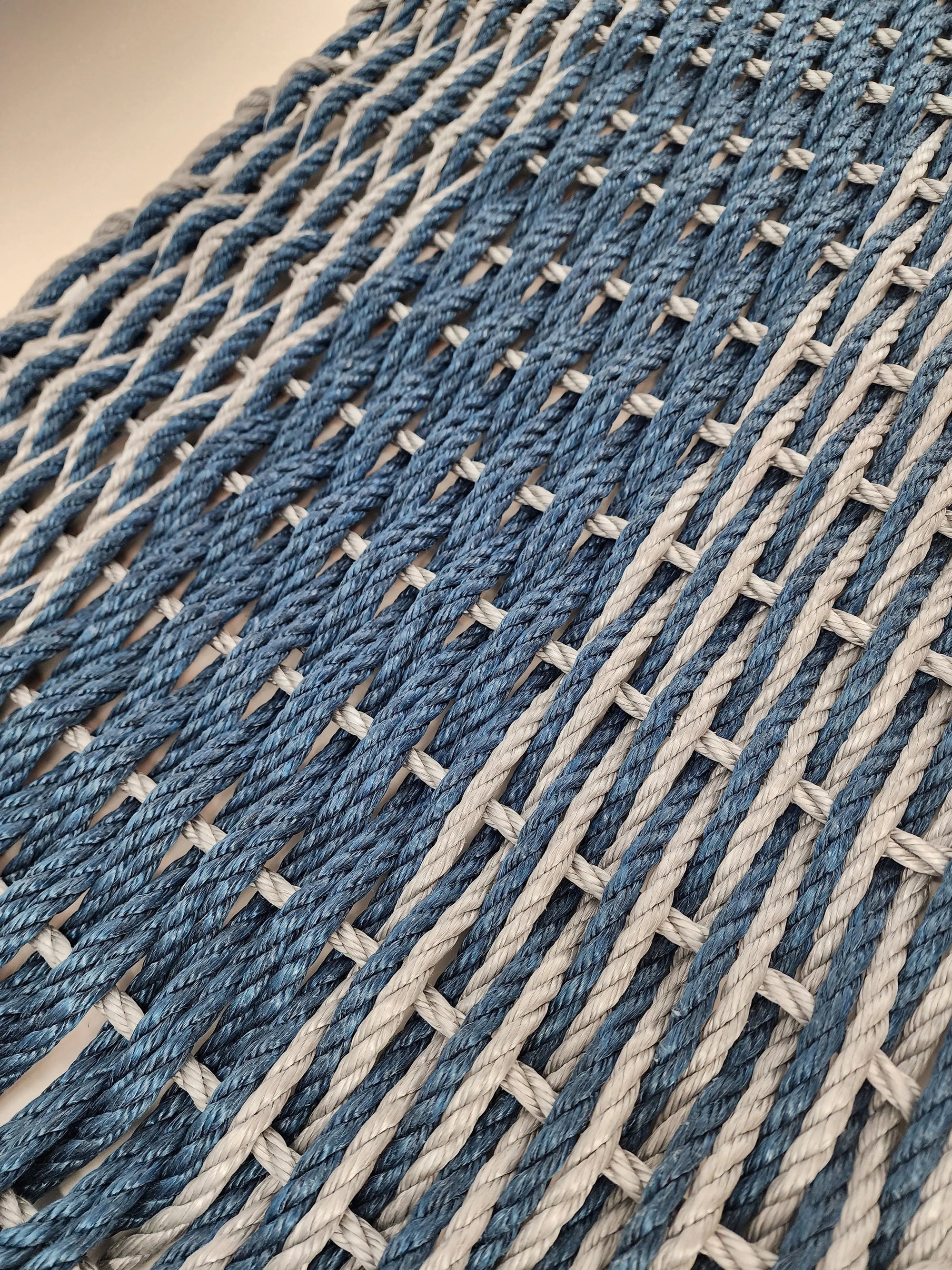Large navy blue and light gray lobster rope mat with double basket weave pattern