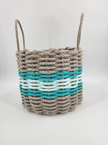 Handmade storage basket woven from Maine lobster rope in tan and seafoam with accent color