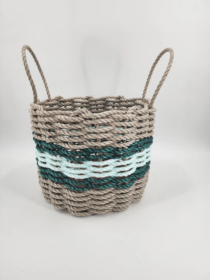 Handmade storage basket woven from Maine lobster rope in tan and seafoam with accent color
