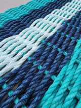 Handmade 5 Stripe Lobster Rope Mat in teal, navy blue, and seafoam colors