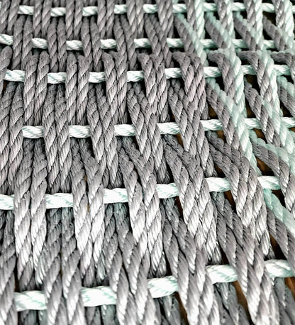 Large double weave lobster rope mat in light gray and seafoam colors