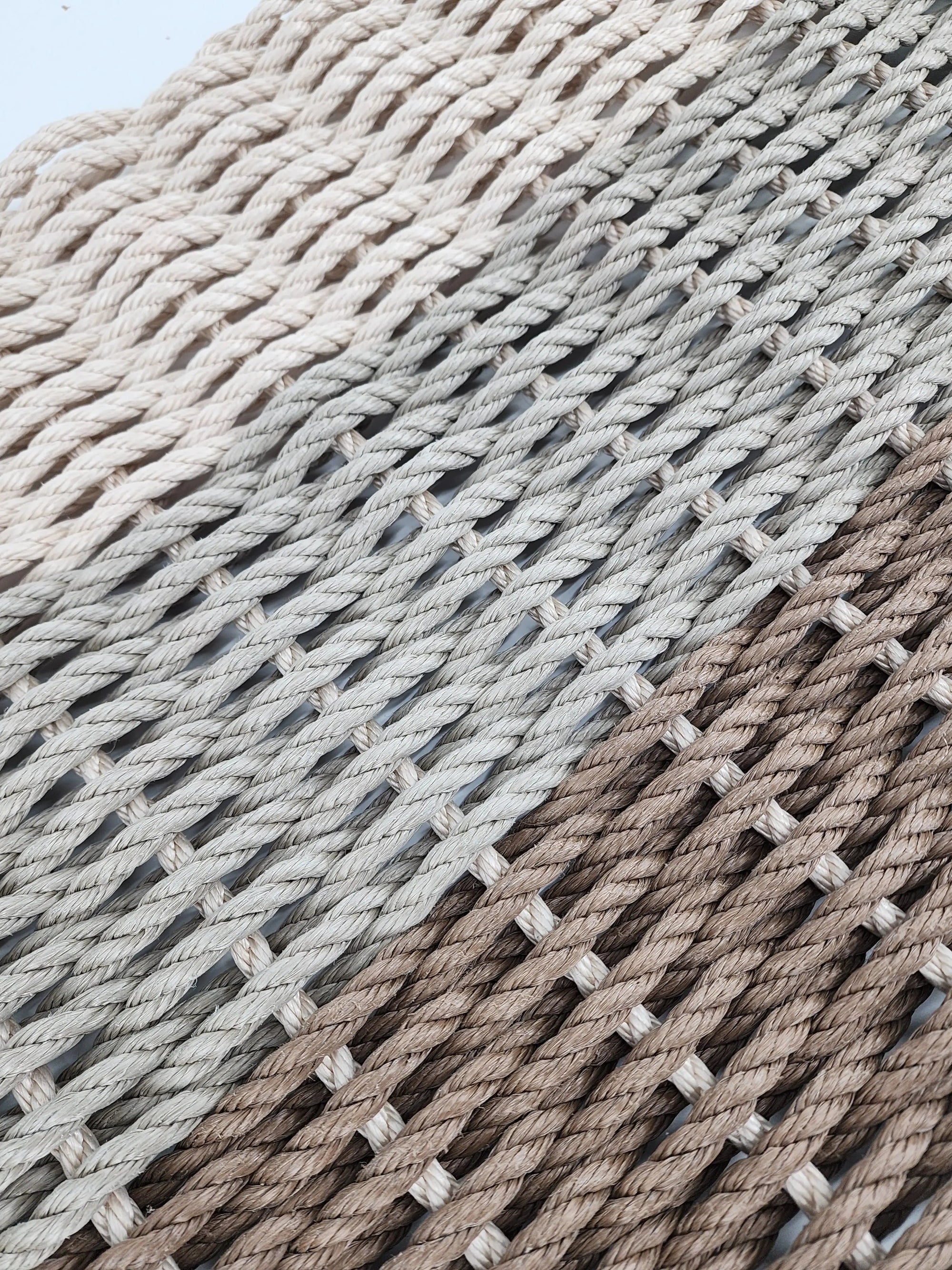 Brown, tan, and light tan ombre handmade rope mat by Little Salty Rope