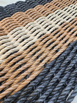 5 Stripe Lobster Rope Mat in black, brown, and tan stripes