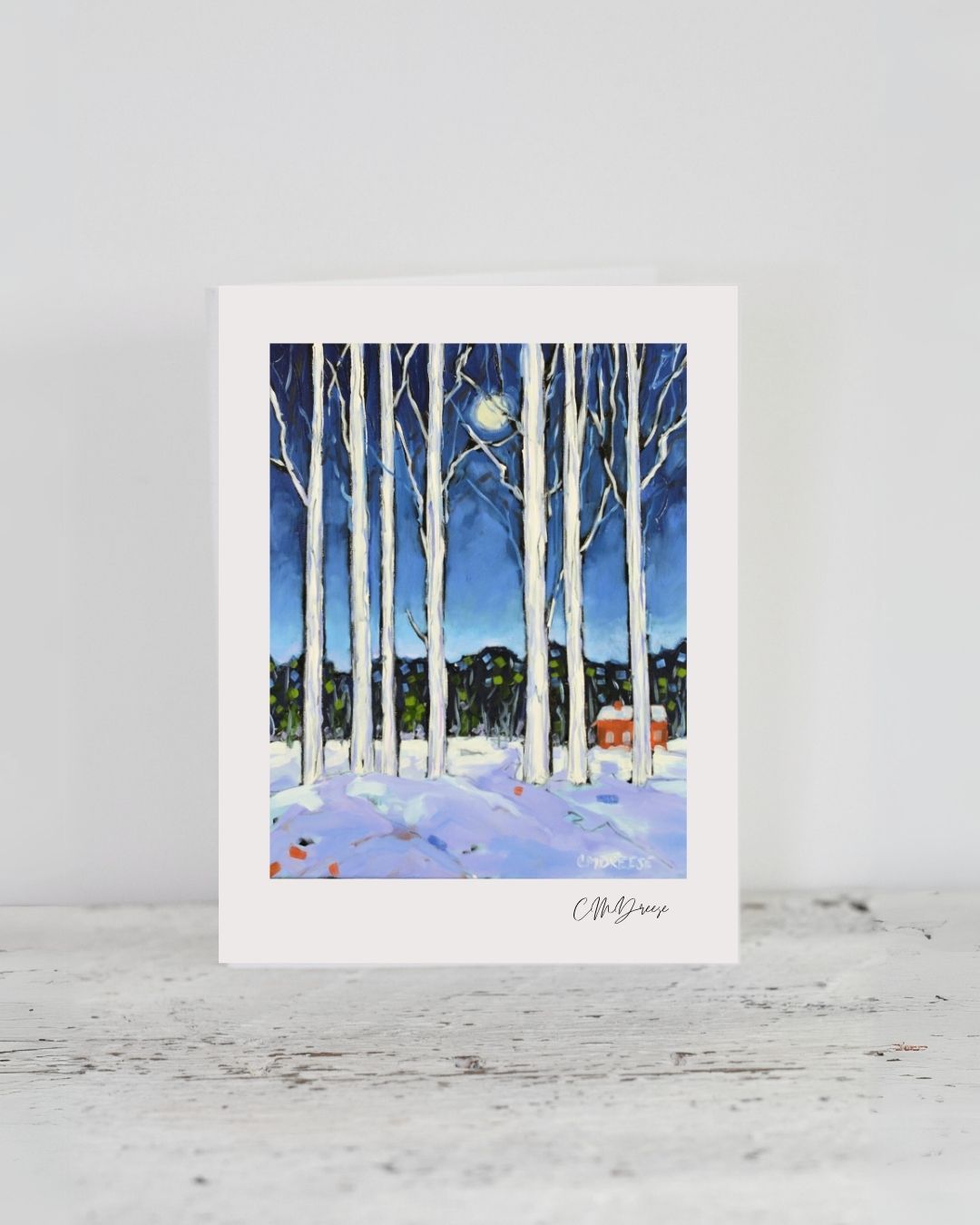 Notecard titled 'Blame it on the Moon' showing birch trees with a full moon and a red cottage in a winter night scene