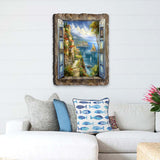 Seaside wall art showing an open blue window with shutters, overlooking a coastal village, sailboats, and cliffs under a partly cloudy sky.