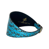 Turquoise and black 4-inch wide collar with textured reptile pattern and a gold-tone buckle, shown in a curved, upright position.
