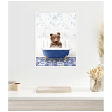 Illustration of a brown bear cub sitting inside a blue clawfoot bathtub filled with white bubbles, standing on a blue and white patterned tile floor with floral wallpaper background.