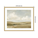 Framed painting of a muted beige and green meadow under a soft blue sky with white clouds, surrounded by a light wood frame with a white mat.
