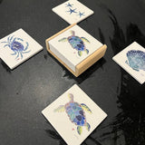 Sea Turtle Coaster set with detailed sea turtle design on a wood caddy holder, styled on a coastal-themed table