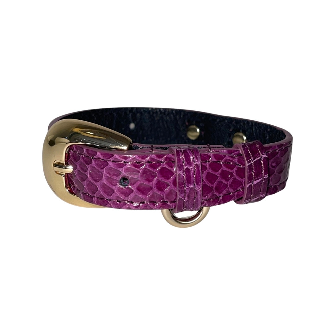 Purple snake-textured collar with a glossy finish, featuring custom gold oval buckle and matching gold hardware D-ring against a black inner lining.