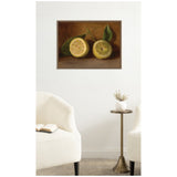 Framed classic still life painting of two halved lemons with green leaves on a brown background, hung on a white wall above a minimalist living room setup.