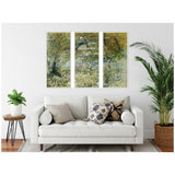 Triptych canvas wall art depicting a springtime river bank with lush green foliage and reflective water, hanging above a modern white sofa with patterned pillows.