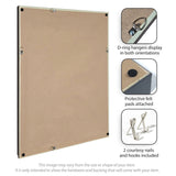 Back of a rectangular framed fabric pinboard showing D-ring hangers in both vertical and horizontal positions, protective black felt pads on corners, and included nails and hooks.