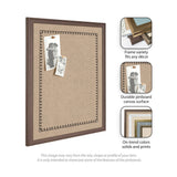 Rectangular pinboard with textured beige canvas and a black scallop border, framed in medium brown wood, displaying two black and white photos pinned at the top left.