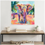 Colorful painting of an African elephant in vibrant pink, orange, and blue tones framed on a wall above a wooden console with books, a mug, and a small plant.