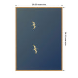 Two white birds flying against a dark blue gradient sky, centered within a light brown wooden frame with outer dimensions 28 by 38 inches