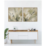 Two-piece abstract floral canvas art featuring soft olive green and cream tones in simple wood frames above a mid-century modern white and wood sideboard with plant and decor accents.