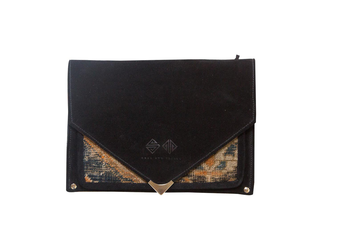 Handmade Rug Fragment Clutch with colorful rug pattern and vegetable suede detailing by Old New House