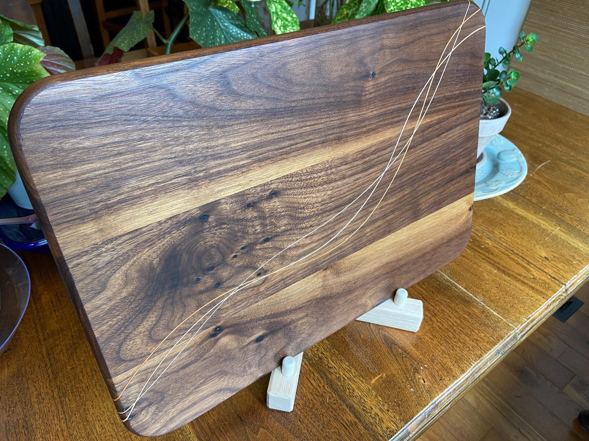 Walnut charcuterie board with Cherry and Maple decorative banding, handcrafted by Fitzgerald Custom Woodcraft