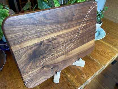 Walnut charcuterie board with Cherry and Maple decorative banding, handcrafted by Fitzgerald Custom Woodcraft