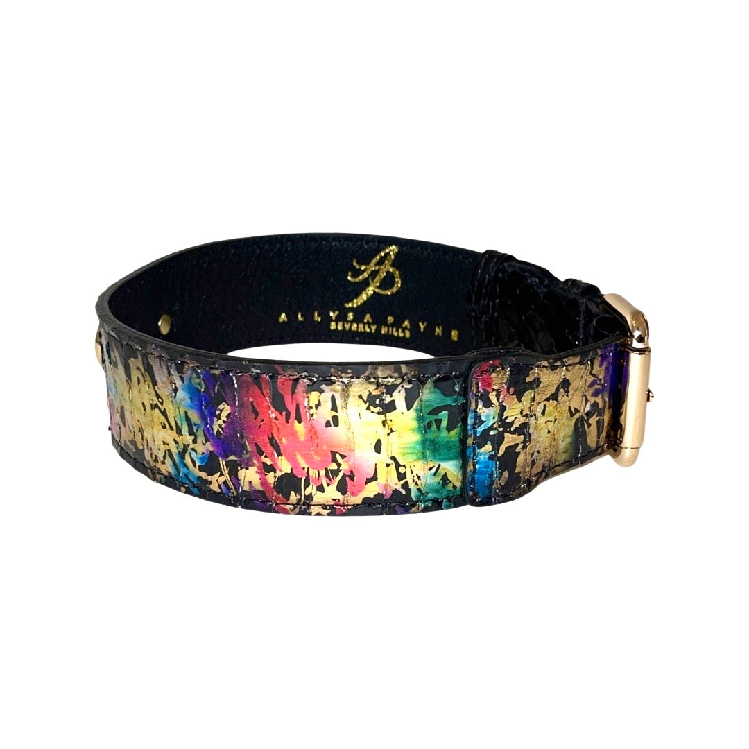 Wide dog collar with a multicolored snake pattern featuring iridescent hues of blue, green, and pink, accented by gold classic hardware and black interior lining.